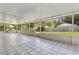 Large screened patio with tile flooring and views of the backyard at 896 Satin Leaf Cir, Ocoee, FL 34761