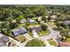 Charming street view of well-kept homes with inviting curb appeal, surrounded by lush greenery and mature trees at 896 Satin Leaf Cir, Ocoee, FL 34761