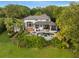 Aerial view of the backyard featuring a swimming pool, lush landscaping, and ample outdoor living space at 9724 Chestnut Ridge Dr, Windermere, FL 34786