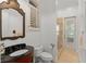 Bathroom with a custom vanity and a large mirror at 9724 Chestnut Ridge Dr, Windermere, FL 34786
