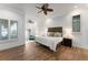 Primary bedroom with ceiling fan and private sitting area at 9724 Chestnut Ridge Dr, Windermere, FL 34786