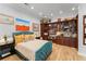 Comfortable bedroom features custom built in cabinetry and hardwood floors at 9724 Chestnut Ridge Dr, Windermere, FL 34786