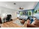 Bedroom features a seating area, a workspace, and a large window at 9724 Chestnut Ridge Dr, Windermere, FL 34786