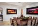 Open dining room featuring a dark wood table and unique wall decor at 9724 Chestnut Ridge Dr, Windermere, FL 34786