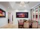 Bright dining room with large table, modern lighting, and arched doorways at 9724 Chestnut Ridge Dr, Windermere, FL 34786