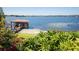Dock with lush landscaping and direct lake access, perfect for boating and water activities at 9724 Chestnut Ridge Dr, Windermere, FL 34786