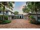 Stunning estate home with manicured landscaping, circular driveway, and attached garages at 9724 Chestnut Ridge Dr, Windermere, FL 34786