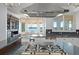 Gourmet kitchen featuring granite countertops, modern appliances, and a breakfast nook with stunning water views at 9724 Chestnut Ridge Dr, Windermere, FL 34786
