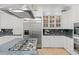 Modern kitchen with stainless steel appliances, granite countertops and custom cabinets at 9724 Chestnut Ridge Dr, Windermere, FL 34786