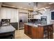 Spacious kitchen with stainless steel appliances, tile backsplash, and ample counter space at 9724 Chestnut Ridge Dr, Windermere, FL 34786