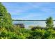 Picture perfect lake views, lush backyard landscaping, and private dock at 9724 Chestnut Ridge Dr, Windermere, FL 34786