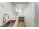Laundry room with granite countertops and stainless steel sink at 9724 Chestnut Ridge Dr, Windermere, FL 34786