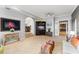 Spacious living room with neutral decor, tile flooring, and an arched entrance leading to additional living spaces at 9724 Chestnut Ridge Dr, Windermere, FL 34786