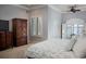 Spacious main bedroom with a large wooden wardrobe and a view of the lake at 9724 Chestnut Ridge Dr, Windermere, FL 34786