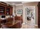 Spacious office with custom built-ins and access to an outdoor balcony at 9724 Chestnut Ridge Dr, Windermere, FL 34786