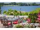A cozy patio offering tranquil water views, perfect for outdoor dining and relaxation at 9724 Chestnut Ridge Dr, Windermere, FL 34786