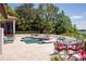 Wonderful pool and spa area with a brick patio, dining table and lounge chairs at 9724 Chestnut Ridge Dr, Windermere, FL 34786