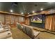 Home theatre features a large screen, comfortable seats, and custom lighting at 9724 Chestnut Ridge Dr, Windermere, FL 34786