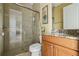 Bathroom with tiled shower, granite vanity, and tile flooring for a modern look at 9736 Hatton Cir, Orlando, FL 32832