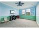 Bright bedroom features a ceiling fan, large windows, and ample space for activities at 9736 Hatton Cir, Orlando, FL 32832