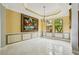 Elegant dining room with decorative molding, large windows, and stylish chandelier at 9736 Hatton Cir, Orlando, FL 32832