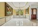 Spacious dining room with large windows, decorative walls, and a chandelier at 9736 Hatton Cir, Orlando, FL 32832