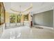 Bright dining room featuring decorative walls, large windows, and an adjacent doorway at 9736 Hatton Cir, Orlando, FL 32832