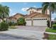 Attractive two-story home boasting a stone facade, red tile roof, and well-maintained landscaping at 9736 Hatton Cir, Orlando, FL 32832