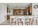Beautiful kitchen with wood cabinets, granite countertops, stainless steel appliances, and breakfast bar at 9736 Hatton Cir, Orlando, FL 32832