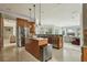 Modern kitchen with stainless steel appliances, granite countertops, and an open view to the living area at 9736 Hatton Cir, Orlando, FL 32832