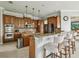 Well-equipped kitchen featuring a breakfast bar, stainless steel appliances, and ample cabinet space at 9736 Hatton Cir, Orlando, FL 32832