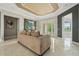 Inviting living room with comfortable seating and doors leading to the outdoor area at 9736 Hatton Cir, Orlando, FL 32832