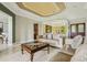 Comfortable living room with neutral tones, tufted sofas, and elegant decor elements at 9736 Hatton Cir, Orlando, FL 32832