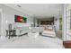 Spacious living room with gray sofa, white accents, and an open layout to the kitchen at 9736 Hatton Cir, Orlando, FL 32832