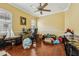 Office with hardwood floors, ceiling fan, natural light, and room for multiple desks at 9736 Hatton Cir, Orlando, FL 32832