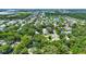 Aerial view of community featuring mature trees and a lake at 1608 Victoria Way, Winter Garden, FL 34787
