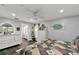 Bright bedroom featuring light gray walls, a ceiling fan, and dark wood floors, creating a cozy retreat at 1608 Victoria Way, Winter Garden, FL 34787