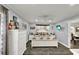 Charming bedroom with light gray walls, white trim, and a ceiling fan, creating a cozy and inviting atmosphere at 1608 Victoria Way, Winter Garden, FL 34787