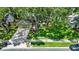 Charming home features lush lawn, mature trees, tidy landscaping, and a two-car garage at 1608 Victoria Way, Winter Garden, FL 34787