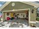 Spacious two-car garage with ample storage space and an attached workshop area perfect for home projects at 1608 Victoria Way, Winter Garden, FL 34787