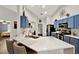 Modern kitchen with white countertops, stainless steel appliances, and lots of cabinet space for storage and functionality at 1608 Victoria Way, Winter Garden, FL 34787