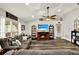 Inviting living room with hardwood floors, a ceiling fan, and a comfortable sofa offering a welcoming and functional space at 1608 Victoria Way, Winter Garden, FL 34787