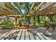 Pergola with a brick patio, fire pit and outdoor furniture at 1608 Victoria Way, Winter Garden, FL 34787