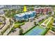An aerial view showcases this building's proximity to a tennis court and nearby marina at 1 Riverwalk Dr # 303, New Smyrna Beach, FL 32169