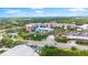 An aerial view shows the building in its neighborhood and reveals its proximity to local waterways at 1 Riverwalk Dr # 303, New Smyrna Beach, FL 32169