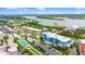 Aerial view of the community, highlighting the building's exterior, lush landscaping, and waterfront location at 1 Riverwalk Dr # 303, New Smyrna Beach, FL 32169