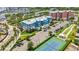 An aerial view showcases this building's proximity to a tennis court and nearby marina at 1 Riverwalk Dr # 303, New Smyrna Beach, FL 32169