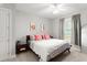 Cozy bedroom featuring a queen-sized bed with colorful pillows and artwork, creating a comfortable and stylish retreat at 1 Riverwalk Dr # 303, New Smyrna Beach, FL 32169