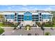 This building's facade is enhanced with lush greenery, a well maintained landscape, and ample parking space at 1 Riverwalk Dr # 303, New Smyrna Beach, FL 32169