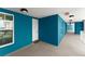 This hallway entrance has a welcome mat and a window at 1 Riverwalk Dr # 303, New Smyrna Beach, FL 32169